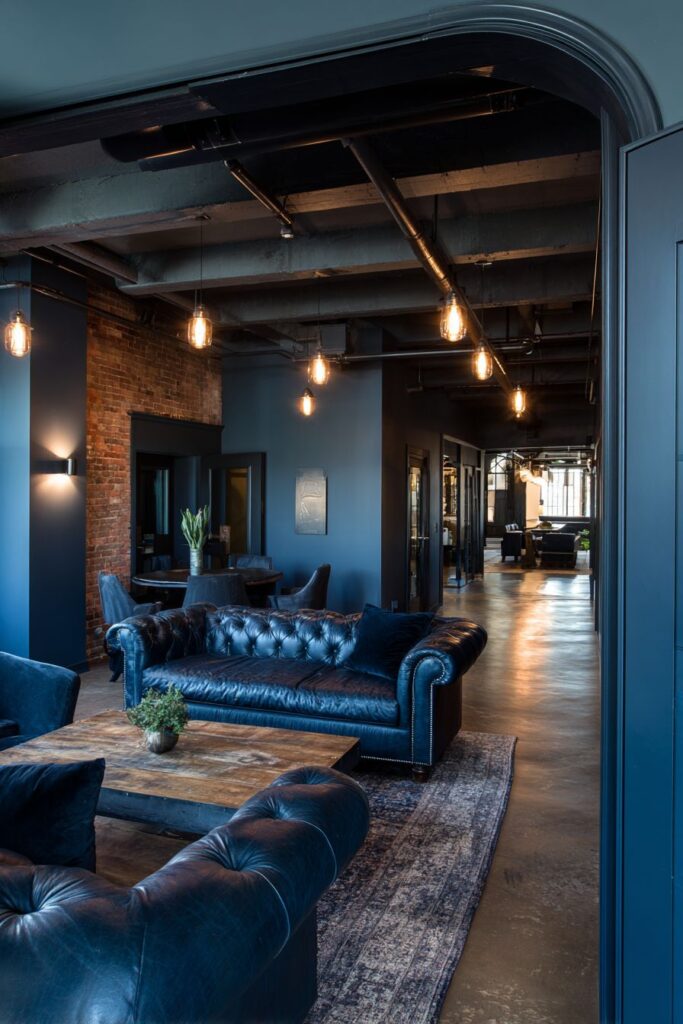 Industrial Edge: Blue Leather Meets Exposed Brick