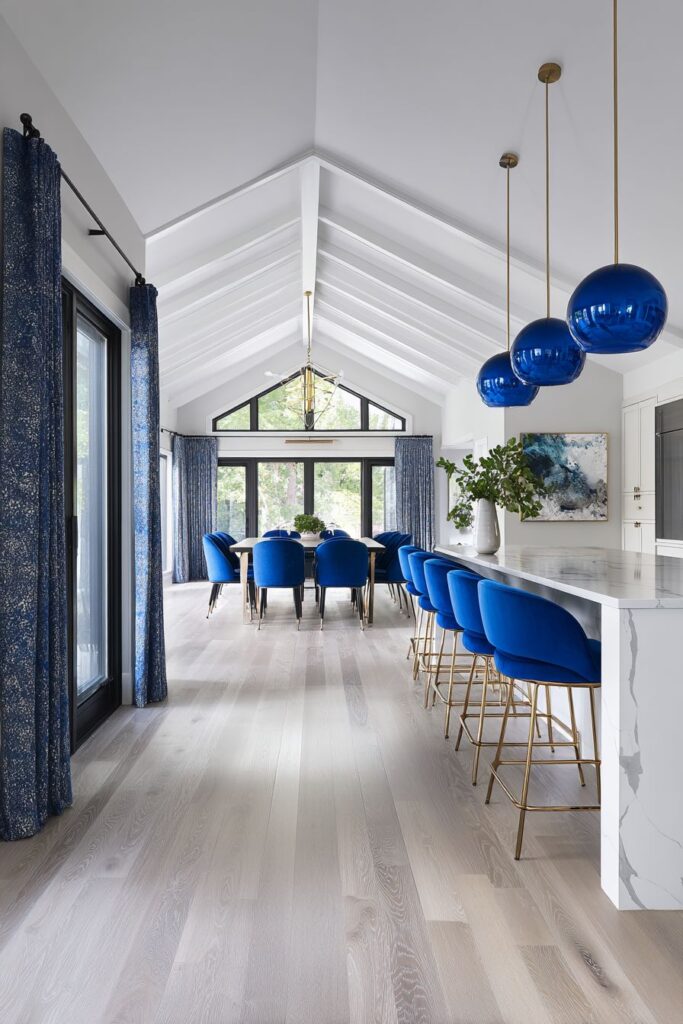 Open Concept Blue Kitchen and Dining Integration