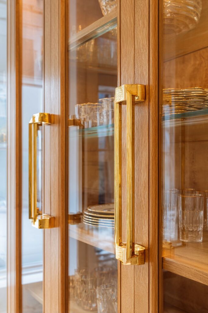 Built-in Storage with Coordinated Gold Hardware