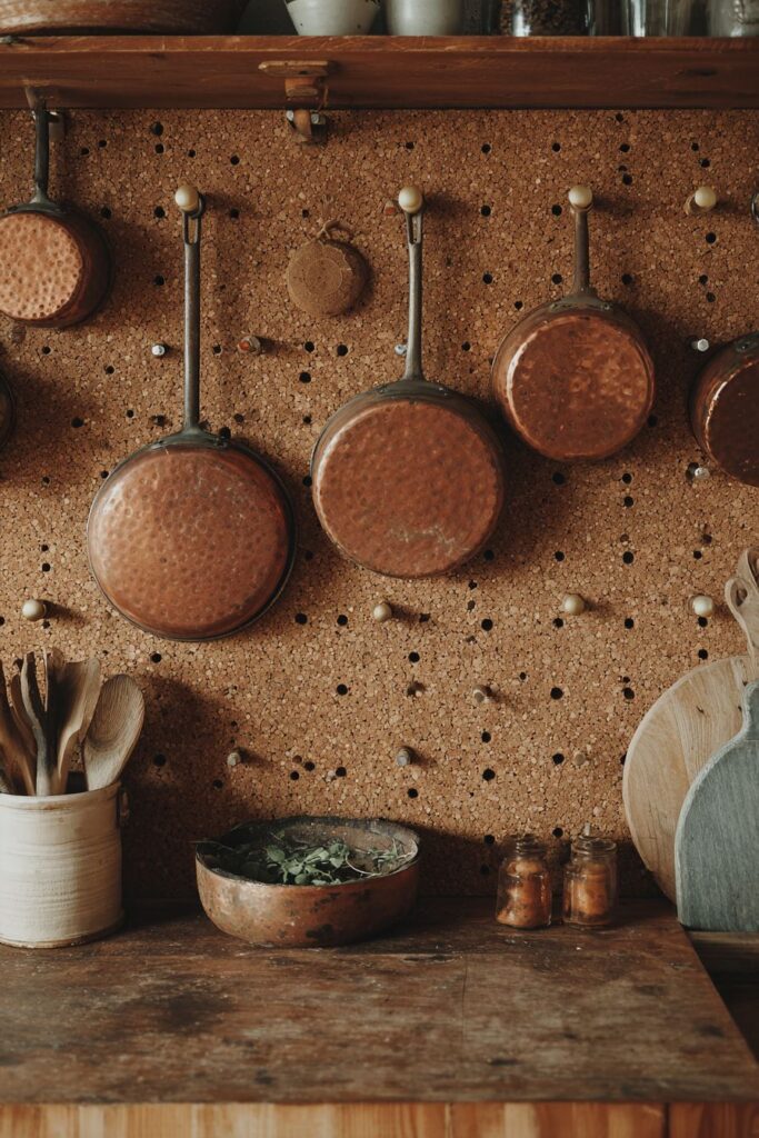 Vintage Copper Cookware Pegboard Display