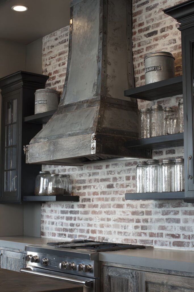 Weathered Steel Range Hood with Exposed Brick