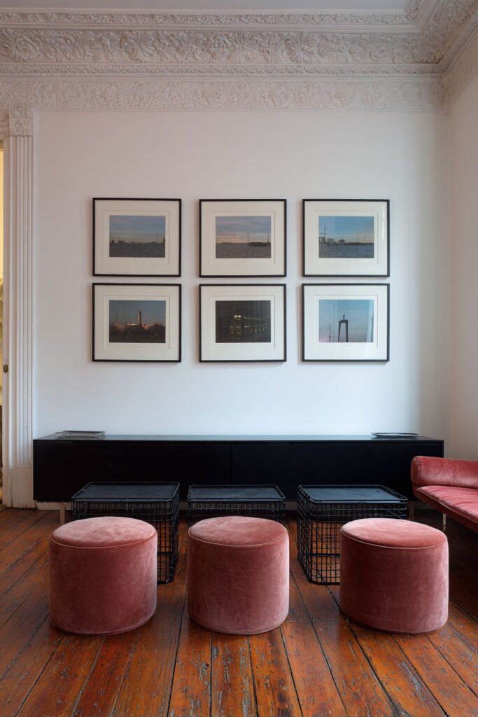 Gallery Wall Drama Above Minimal Furnishings